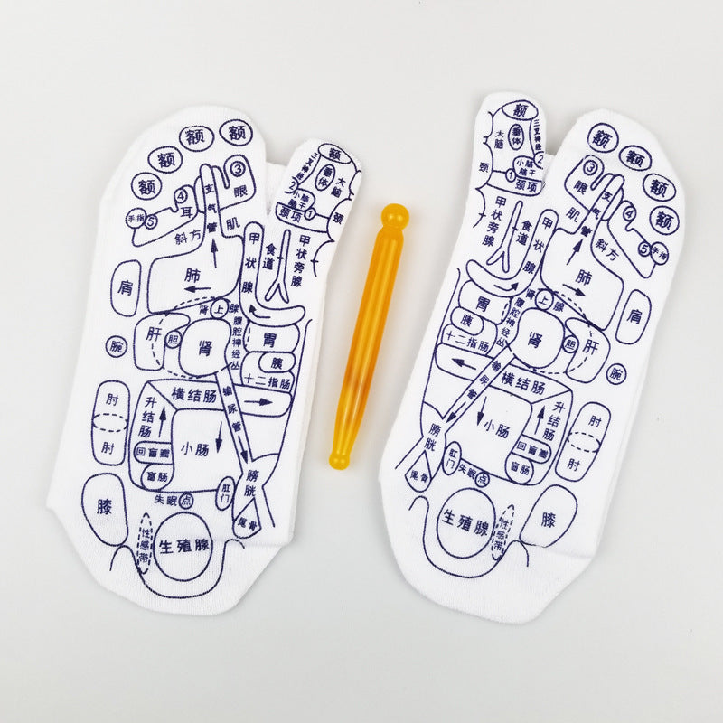 Reflexology socks with acupressure charts and massage stick for foot therapy.